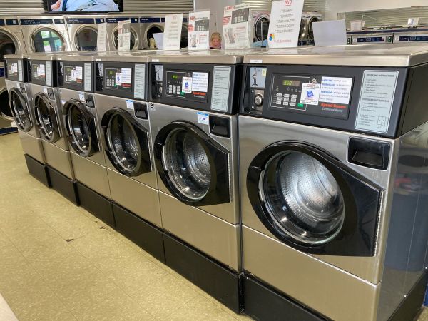 Washing machines and dryers at the Country Charm Laundromat in Plymouth.