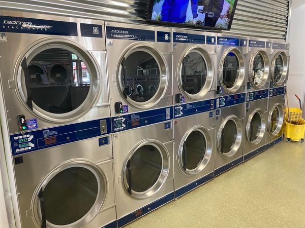 A row of large capacity dryers.