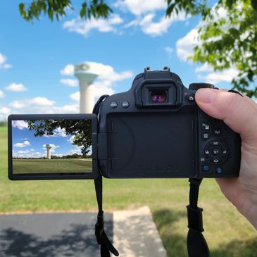 A held camera taking a picture