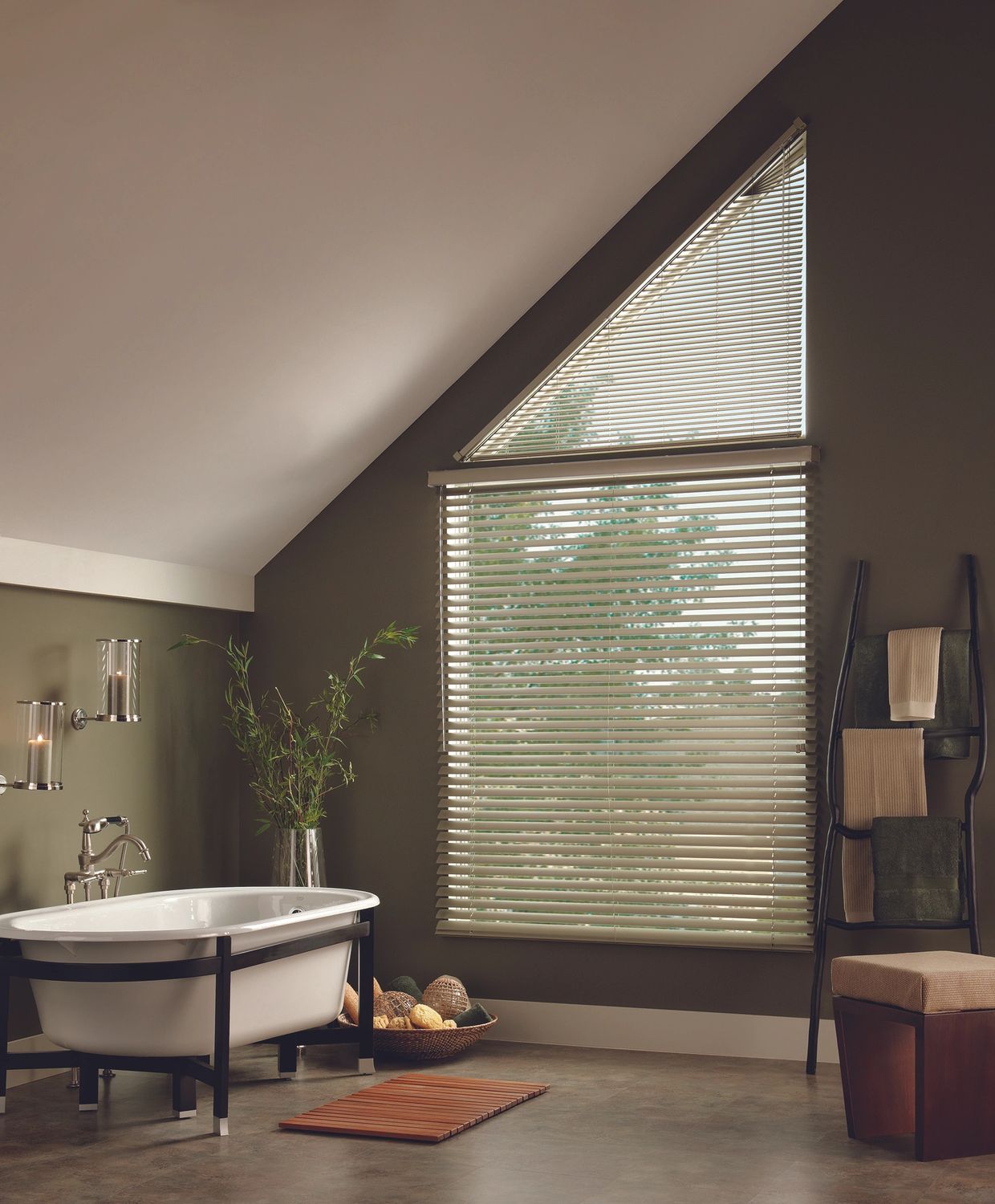 Blinds expertly installed in the angled window of a bathroom