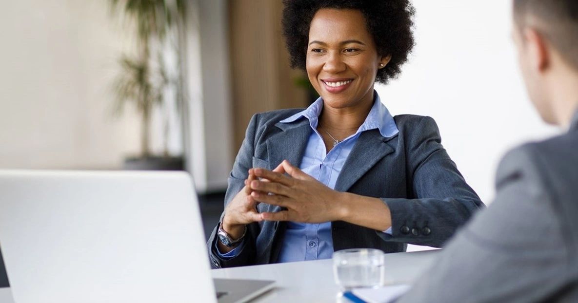 Portrait of business woman, smiling at camera, toothy smile.
