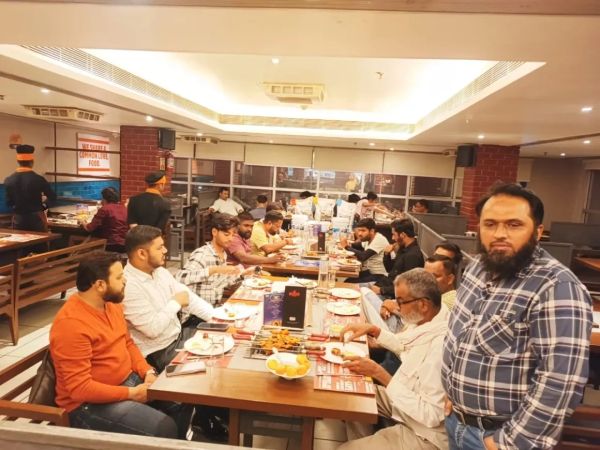 Group dining together at a restaurant table.