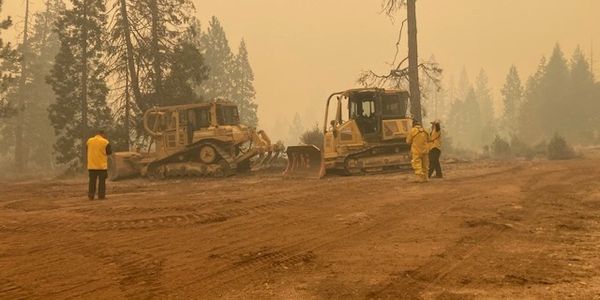 Dozers working during wildland fire emergency
