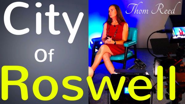 A woman sitting on a chair with 'City of Roswell' text overlay.