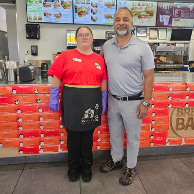 Bal Bains with store staff standing by donation boxes.