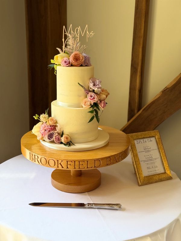Rustic Semi Naked 2 tier wedding cake with fresh flowers