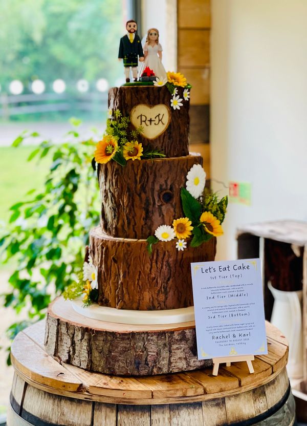 3 tier rustic tree stump wedding cake with sugar sunflowers and daisies 