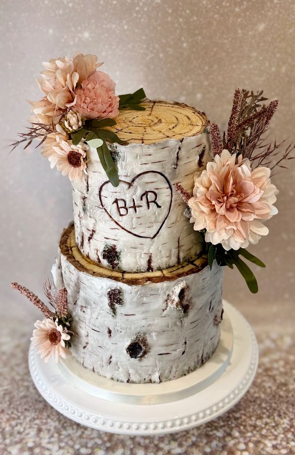 2 tier Silver Birch tree stump cake with pretty pink silk flowers