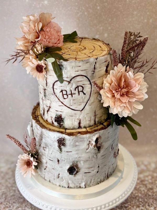 2 tier Silver Birch tree stump cake with pretty pink silk flowers