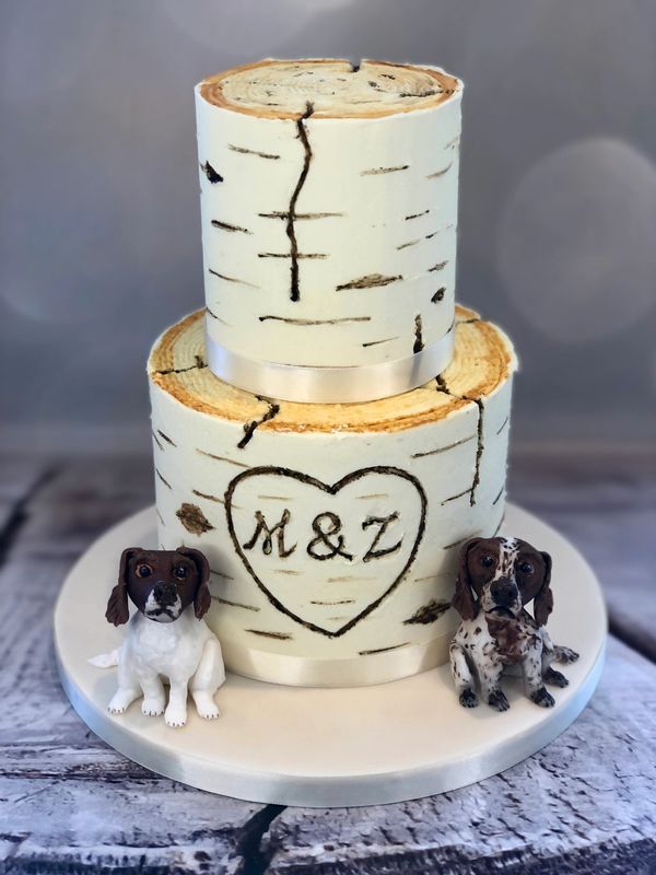 2 tiered buttercream birch tree wedding cake with bespoke Spaniel dog cake toppers