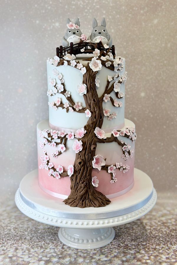 Pink ombre effect fondant wedding cake with cherry blossom tree and Totoro cake topper