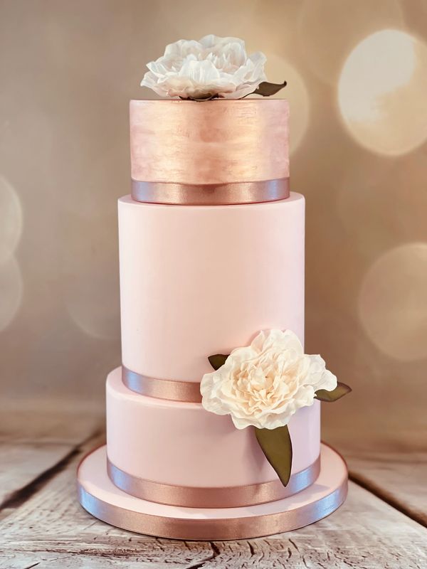 Simple pink and rose gold 3 tier wedding cake with silk flowers