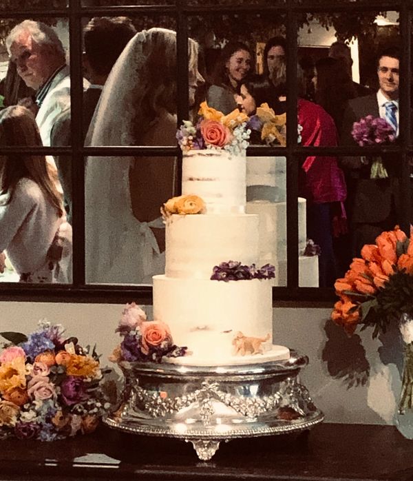 Stunning and elegant 3 tiered semi naked wedding cake with fresh flowers