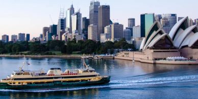 Sydney skyline with a ferry and the Opera House.