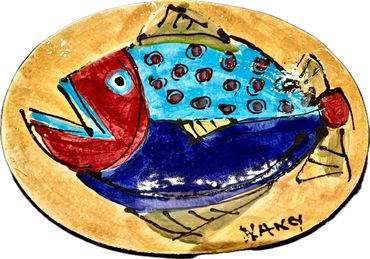 Colorful fish painting on an oval plate.