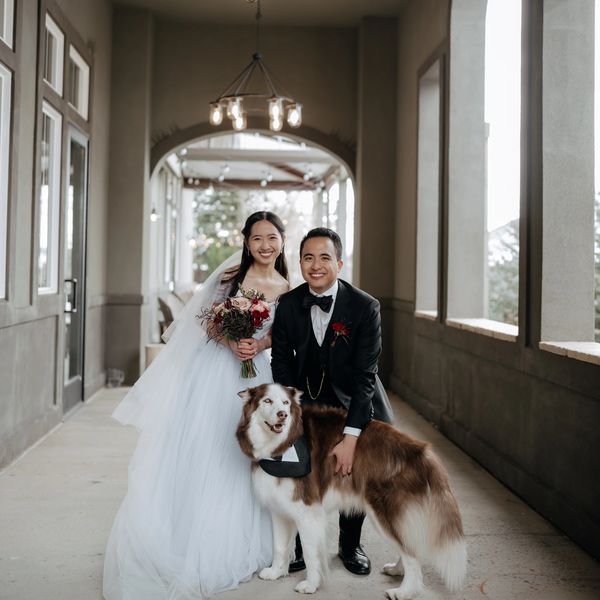 The owners of the business with their siberian husky dog