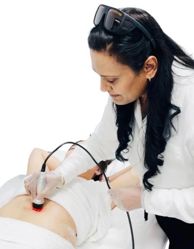Woman using a laser device on another person's abdomen in a clinical setting.