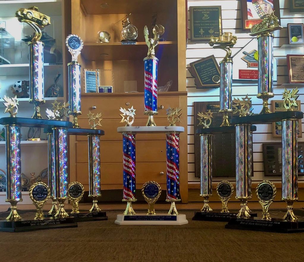 Five two-tier column trophies with all the trimmings. 