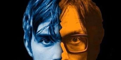 Split face with one side blue and the other orange with glasses.