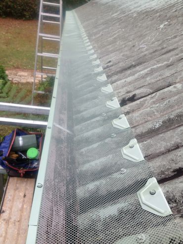 Gutter protection being installed