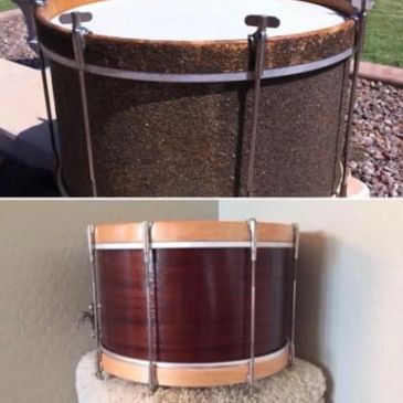 Two vintage snare drums with different finishes.