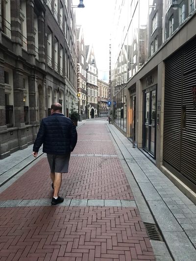 John Keith walking down the street