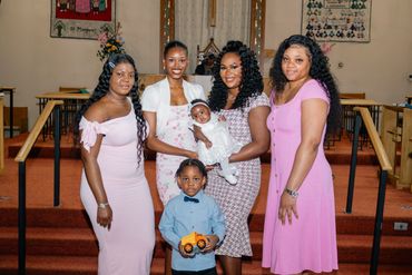 Group photo of women and children in a church.