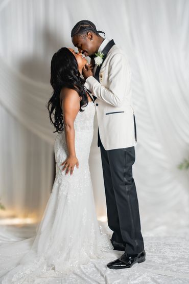 Romantic wedding moment between bride and groom.