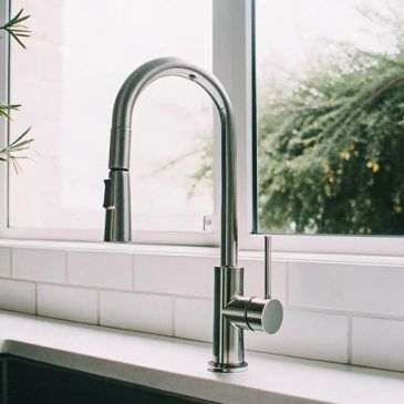 Modern kitchen faucet with high arch and single handle.