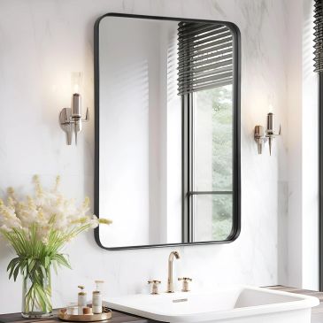 Modern bathroom mirror with decorative lighting and flowers.