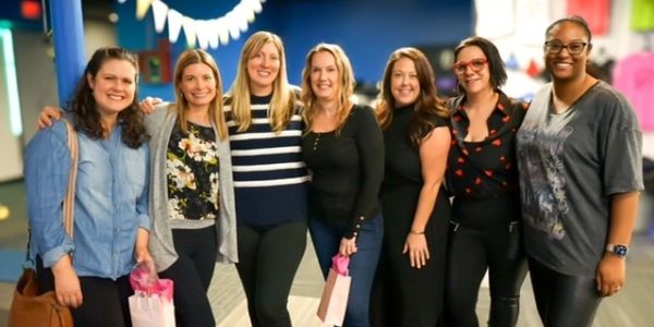 A group of women smiling during a community event hosted by A Better Self in Vernon, CT.
