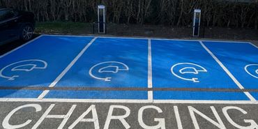 EV charging bay line markings in Norfolk car park – WR Road Markings
