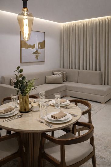 Elegant dining and living room with a neutral color palette.