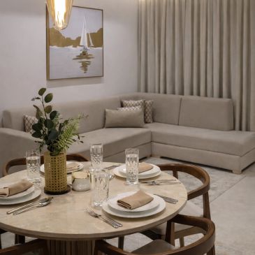 Elegant dining and living room with a neutral color palette.