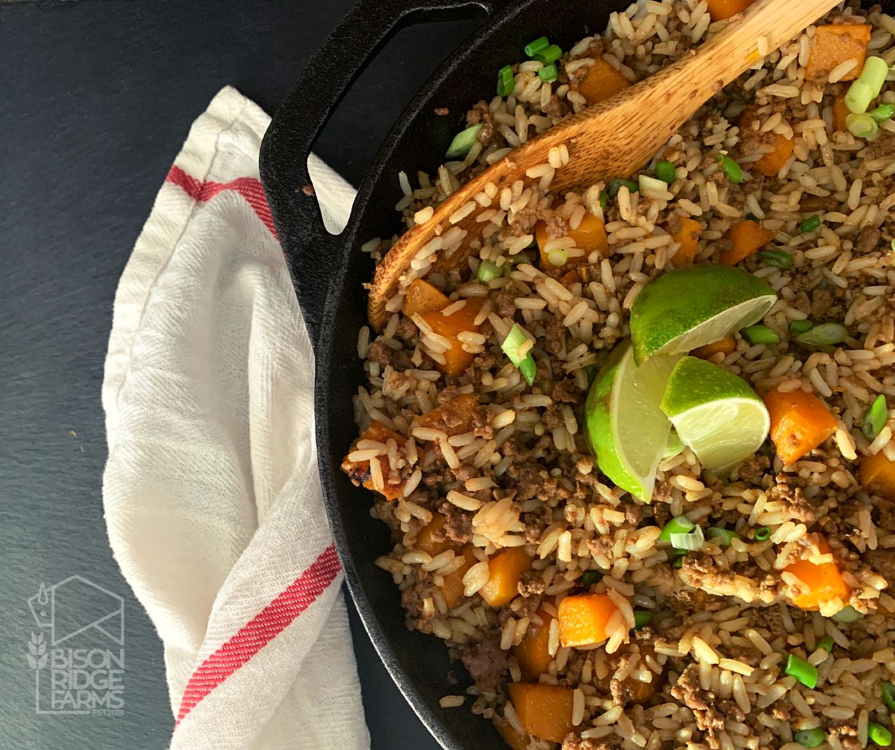 Bison and squash fried rice in a cast iron skillet
