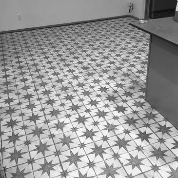 Kitchen floor with decorative 18 x 18 tiles with 1/16th grout joints