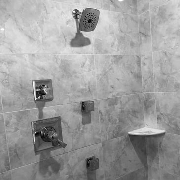 Multi-head custom shower with 12 x 24 porcelain tile
