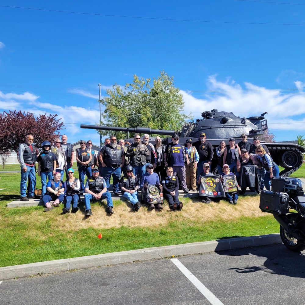 CVMA group posing in front of tank
