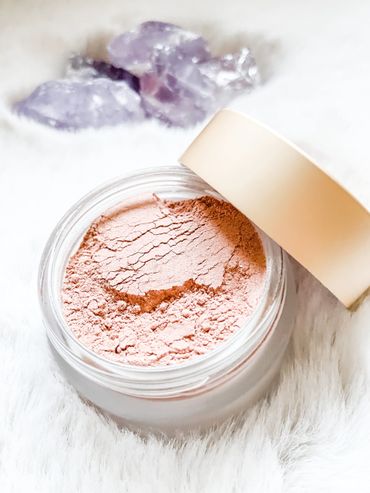 Leo's Light reiki-infused makeup product, light pink powder in glass pot 