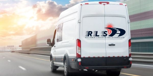 A white delivery van with RLS logo driving on a highway at sunset.