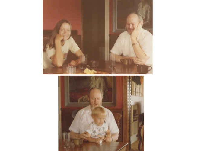 Two people sitting at a table with drinks, smiling and resting their heads on their hands.