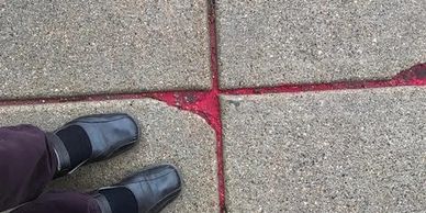 Red sand in sidewalks