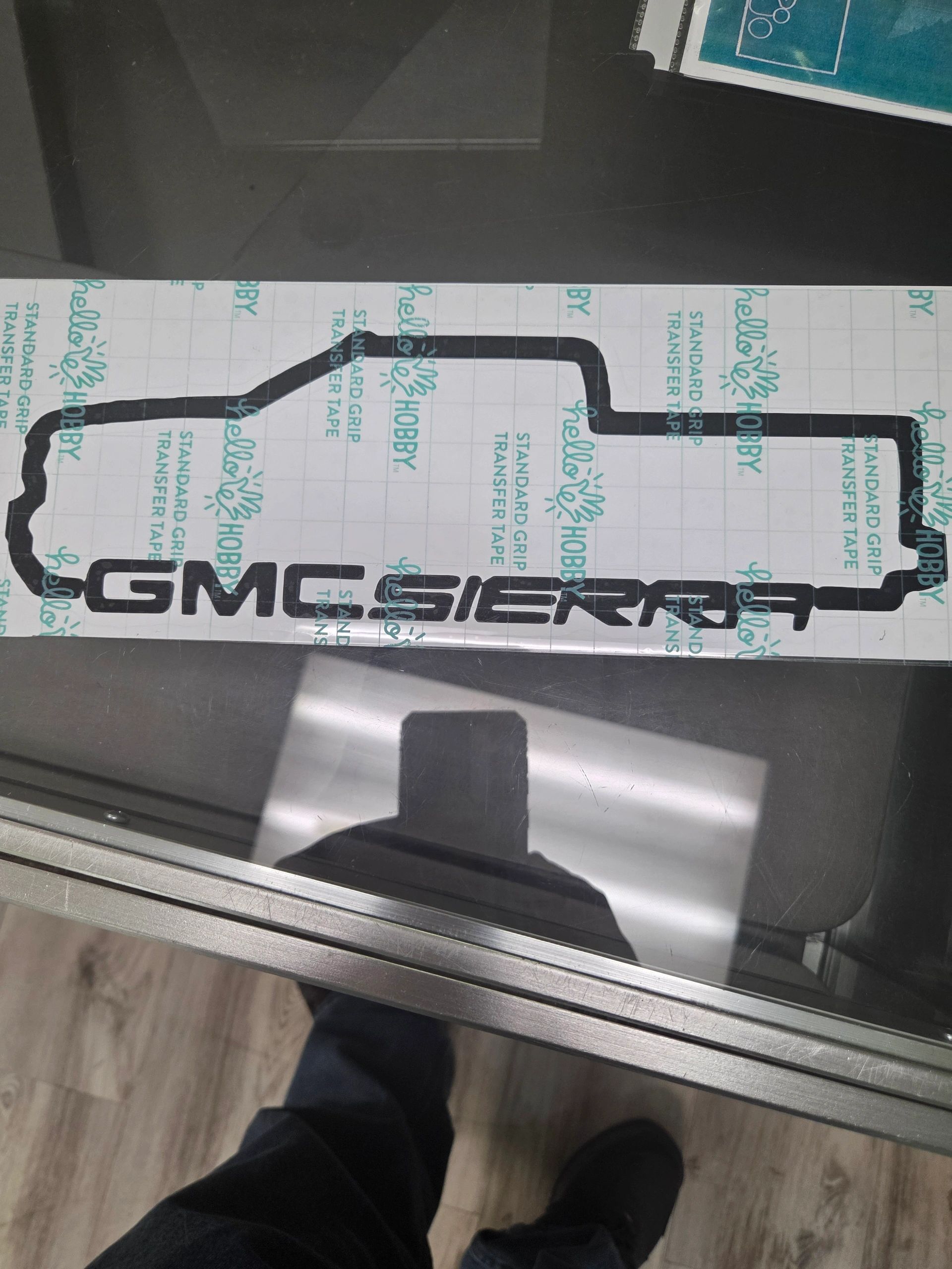 A decal for GMC Sierra with an outline of the truck's shape.