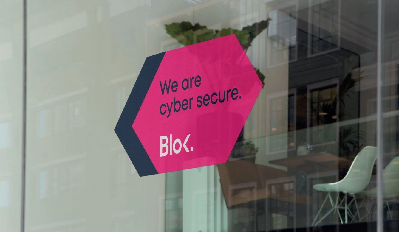 Blok - we are cyber secure window sticker displayed at a customers office