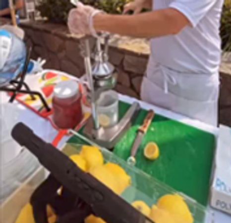 Smashing lemons to make lemonade.