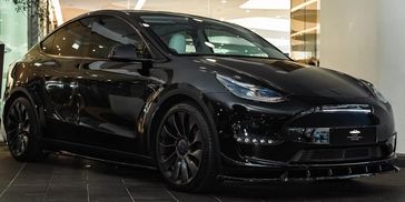 Eco-friendly Tesla Model Y electric SUV offering modern luxury and sustainability.