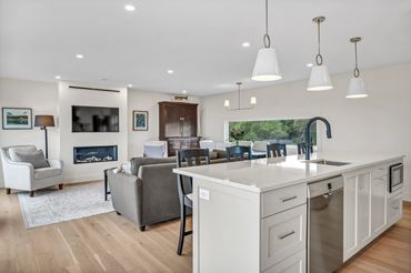 nova scotia cottage kitchen open concept to living room. bright and clean space.