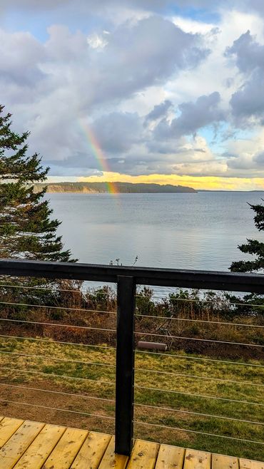 NS Dome private deck with rainbow over ocean