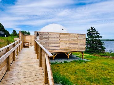 NS Dome exterior showing private deck, accessible ramp and ocean view