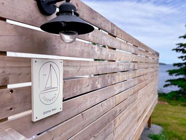 NS Dome privacy fence with light and sign